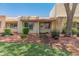 Charming single-story home with a brick walkway, mature landscaping, and a freshly manicured green lawn at 1808 W Rose Ln, Phoenix, AZ 85015