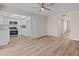 Spacious living room showcasing open concept design with wood-look flooring and eat-in kitchen at 1808 W Rose Ln, Phoenix, AZ 85015