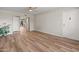 Open living room with wood floors, recessed lighting, and access to other rooms at 1808 W Rose Ln, Phoenix, AZ 85015