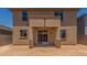 Backyard with a covered patio area and stucco exterior at 18351 W Patrick Ln, Surprise, AZ 85387
