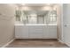 Bathroom featuring a large double vanity, tile floor, and bright lighting at 18351 W Patrick Ln, Surprise, AZ 85387