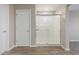 Bathroom features tile floor, enclosed glass shower, and standard door at 18351 W Patrick Ln, Surprise, AZ 85387