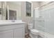 Bathroom featuring white vanity, toilet, and glass enclosed shower at 18351 W Patrick Ln, Surprise, AZ 85387