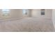 Bright bedroom with carpet floors, neutral walls, and large windows at 18351 W Patrick Ln, Surprise, AZ 85387