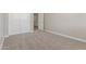 Cozy bedroom features carpet flooring and a built in closet at 18351 W Patrick Ln, Surprise, AZ 85387