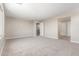 Open-concept bonus room featuring neutral paint, carpet flooring, and bright natural light at 18351 W Patrick Ln, Surprise, AZ 85387