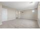 Large bonus room with neutral paint, carpet flooring, and great natural light at 18351 W Patrick Ln, Surprise, AZ 85387