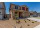 Charming two-story home featuring a two-car garage, red shutters, and desert landscaping at 18351 W Patrick Ln, Surprise, AZ 85387