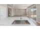 Kitchen island sink in a new build featuring stainless steel appliances and an open space at 18351 W Patrick Ln, Surprise, AZ 85387