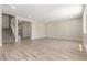 Bright living room featuring stairs, hard wood floors and access to other rooms at 18351 W Patrick Ln, Surprise, AZ 85387