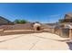 Outdoor living space featuring a built-in fireplace, barbecue grill, and seating for entertainment in a private backyard at 18449 W Piedmont Rd, Goodyear, AZ 85338