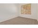 Small bedroom with carpet and a single shuttered window at 18449 W Piedmont Rd, Goodyear, AZ 85338
