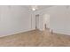 Bedroom with neutral paint, wood-look floors, ceiling fan, and arched doorway at 18449 W Piedmont Rd, Goodyear, AZ 85338