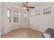 Bright dining room with multiple windows and a ceiling fan at 18449 W Piedmont Rd, Goodyear, AZ 85338