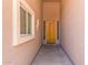 Inviting entryway with a wood front door, window, and neutral paint at 18449 W Piedmont Rd, Goodyear, AZ 85338