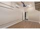 Clean garage featuring laminate flooring, ample room for storage, and easy access to the home's interior at 18449 W Piedmont Rd, Goodyear, AZ 85338