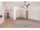 Bright and airy open-concept living area with neutral tile floors and plenty of natural light from every angle at 18449 W Piedmont Rd, Goodyear, AZ 85338