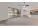Bright living room showcasing sliding glass doors with backyard views at 18449 W Piedmont Rd, Goodyear, AZ 85338