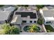 Overhead shot of a property with a pool, solar panels, and tile roof, set in a desirable neighborhood at 1865 E Locust Pl, Chandler, AZ 85286
