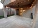 Covered back patio with ceiling fan and string lights with access to the interior at 1865 E Locust Pl, Chandler, AZ 85286