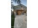 A view of the backyard patio with string lights and a well maintained lawn at 1865 E Locust Pl, Chandler, AZ 85286