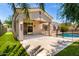 Inviting back patio with a pool featuring concrete and artificial grass; perfect for outdoor entertaining and relaxation at 1865 E Locust Pl, Chandler, AZ 85286