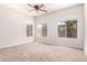 An unfurnished bedroom boasts natural light and neutral colors, ready for your personal touch and decor at 1865 E Locust Pl, Chandler, AZ 85286