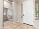 Inviting foyer with tile flooring, neutral paint, and natural light. Great view into a study at 1865 E Locust Pl, Chandler, AZ 85286