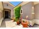 Cozy front porch with vibrant potted plants, colorful decorations, and a welcoming entrance at 1865 E Locust Pl, Chandler, AZ 85286