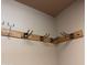 Wall-mounted utility rack in garage offering space for storage at 1865 E Locust Pl, Chandler, AZ 85286