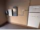 View of the power storage solution, equipped with a Tesla powerwall and charging station at 1865 E Locust Pl, Chandler, AZ 85286