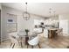 Stylish kitchen with white cabinetry, stainless steel appliances, granite countertops, and a cozy breakfast nook at 1865 E Locust Pl, Chandler, AZ 85286