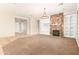 An inviting living room featuring a stone fireplace and an open floor plan, ready for your personal touches at 1865 E Locust Pl, Chandler, AZ 85286