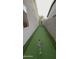 Artificial turf in a side yard transformed into a private putting green at 1865 E Locust Pl, Chandler, AZ 85286