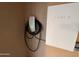 Tesla charger and powerwall in the garage for energy storage at 1865 E Locust Pl, Chandler, AZ 85286