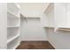 A spacious walk-in closet with ample shelving and hanging space, perfect for organization at 1865 E Locust Pl, Chandler, AZ 85286