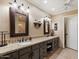 Spacious bathroom with dual sinks, decorative mirrors, and stylish cabinets at 18780 N 94Th Ave, Peoria, AZ 85382