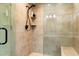 Modern shower features tile surround, built-in shelves, and a rainfall showerhead at 18780 N 94Th Ave, Peoria, AZ 85382