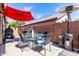 Outdoor backyard with red umbrella, barbecue, and patio furniture at 20038 N 38Th Ln, Glendale, AZ 85308