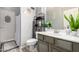 Bathroom featuring modern shelving, new fixtures, and decorative plant at 20038 N 38Th Ln, Glendale, AZ 85308