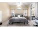 Neutral bedroom with a ceiling fan, and a gray bed set at 20038 N 38Th Ln, Glendale, AZ 85308