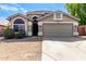 Attractive home boasts a clean exterior with a two-car garage and desert landscaping at 20038 N 38Th Ln, Glendale, AZ 85308