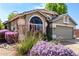 Charming single-story home showcasing mature landscaping and a neutral color scheme at 20038 N 38Th Ln, Glendale, AZ 85308
