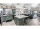 Open kitchen featuring an island, sleek appliances, and views into the living area at 20038 N 38Th Ln, Glendale, AZ 85308
