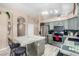 Charming kitchen with a stainless steel refrigerator, tile backsplash, and a large island at 20038 N 38Th Ln, Glendale, AZ 85308