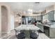 Well-equipped kitchen featuring a center island, stainless steel appliances, and stylish lighting at 20038 N 38Th Ln, Glendale, AZ 85308