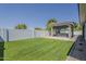 Spacious backyard with privacy fence and a covered hot tub at 20452 E Appaloosa Dr, Queen Creek, AZ 85142