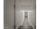 Stairway to basement featuring durable gray hardwood flooring and white walls at 20452 E Appaloosa Dr, Queen Creek, AZ 85142