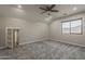 Spacious bedroom with vaulted ceiling, carpet floors, a window, and a unique built-in shelf space at 20452 E Appaloosa Dr, Queen Creek, AZ 85142
