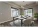 This dining room features marble table, modern lighting and view of backyard at 20452 E Appaloosa Dr, Queen Creek, AZ 85142